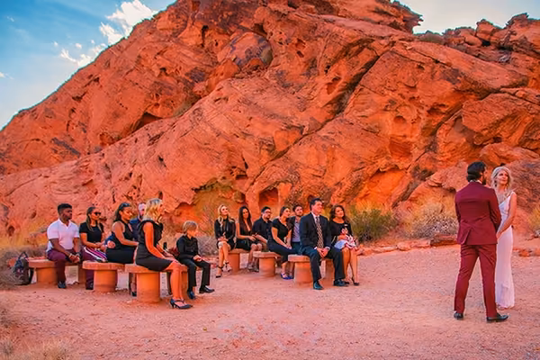 Couple and guests at the Wedding Center's stone bench seating, Valley of Fire State Park